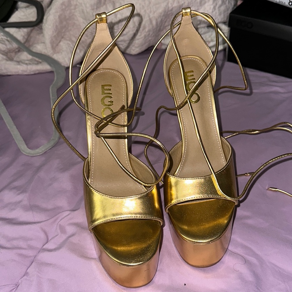 Gold high heels